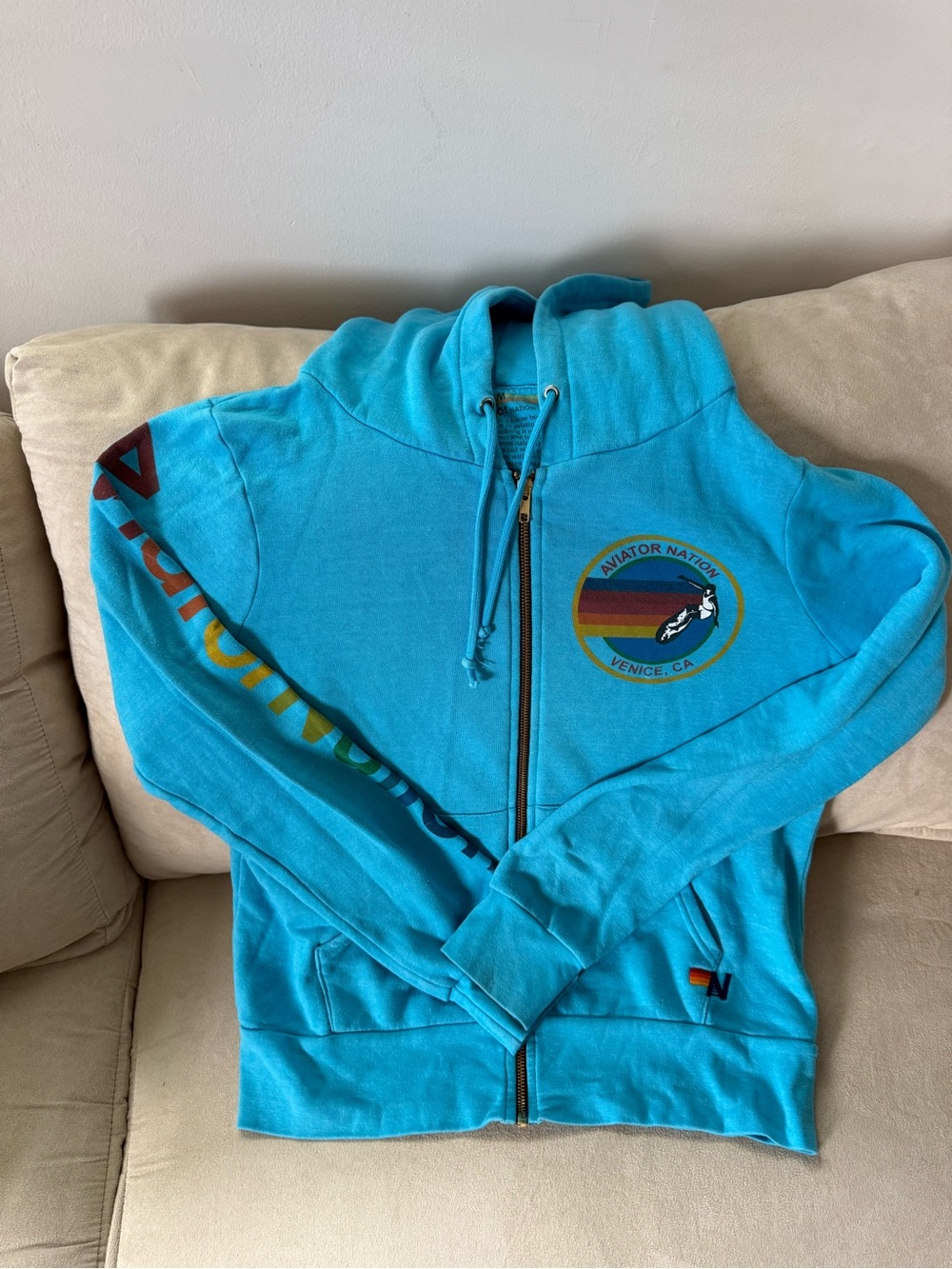 Aviator Nation Women’s Teal Zip-Up Hoodie with Rainbow Sleeve Logo